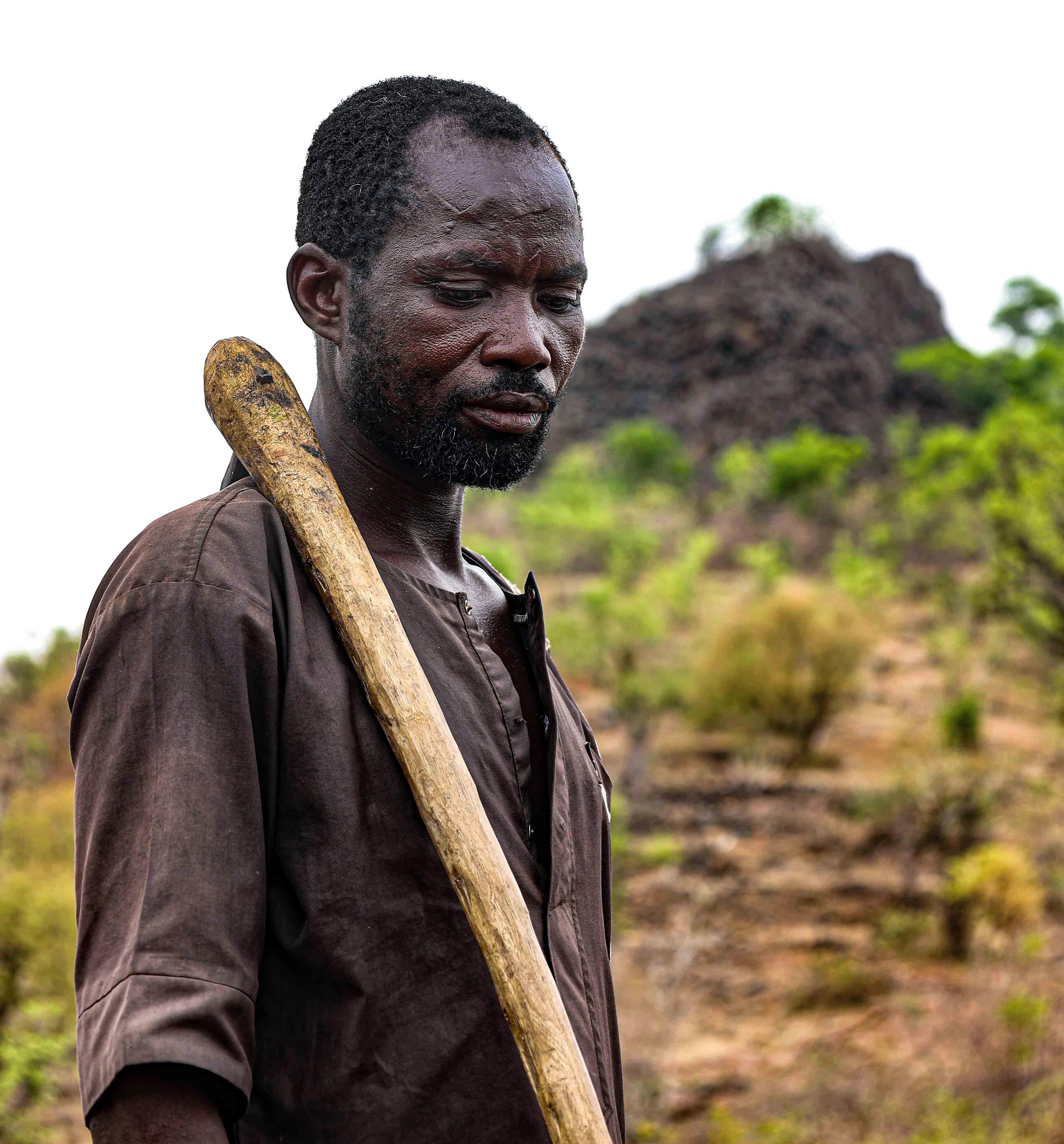 Farmer smiling with crops